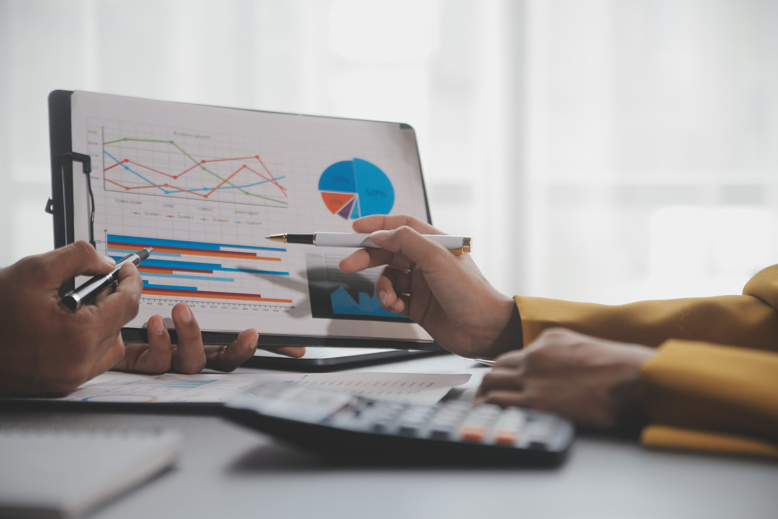 financial analysts analyze business financial reports on a digi