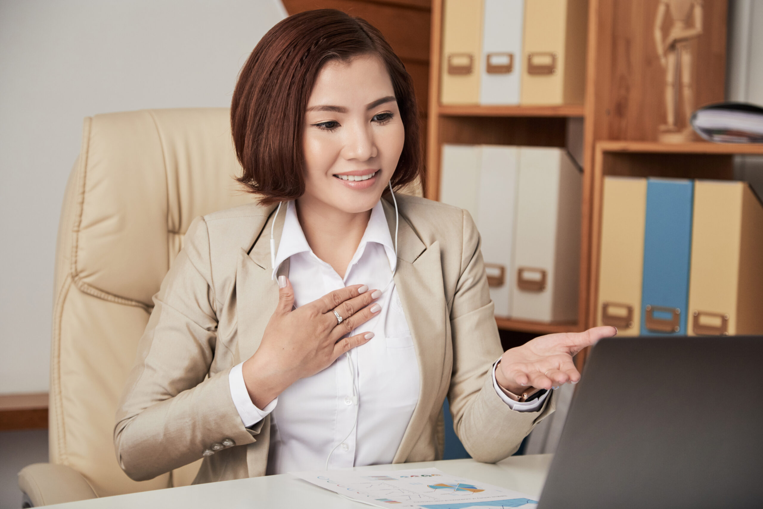 young ethnic businesswoman having video call